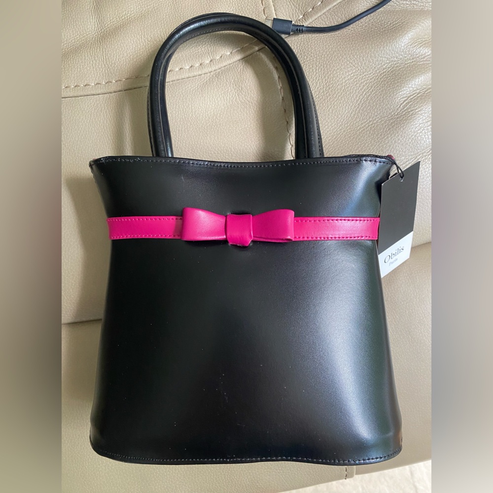 Obilis genuine leather handbag. Black with pink bow detail. New with tags.
